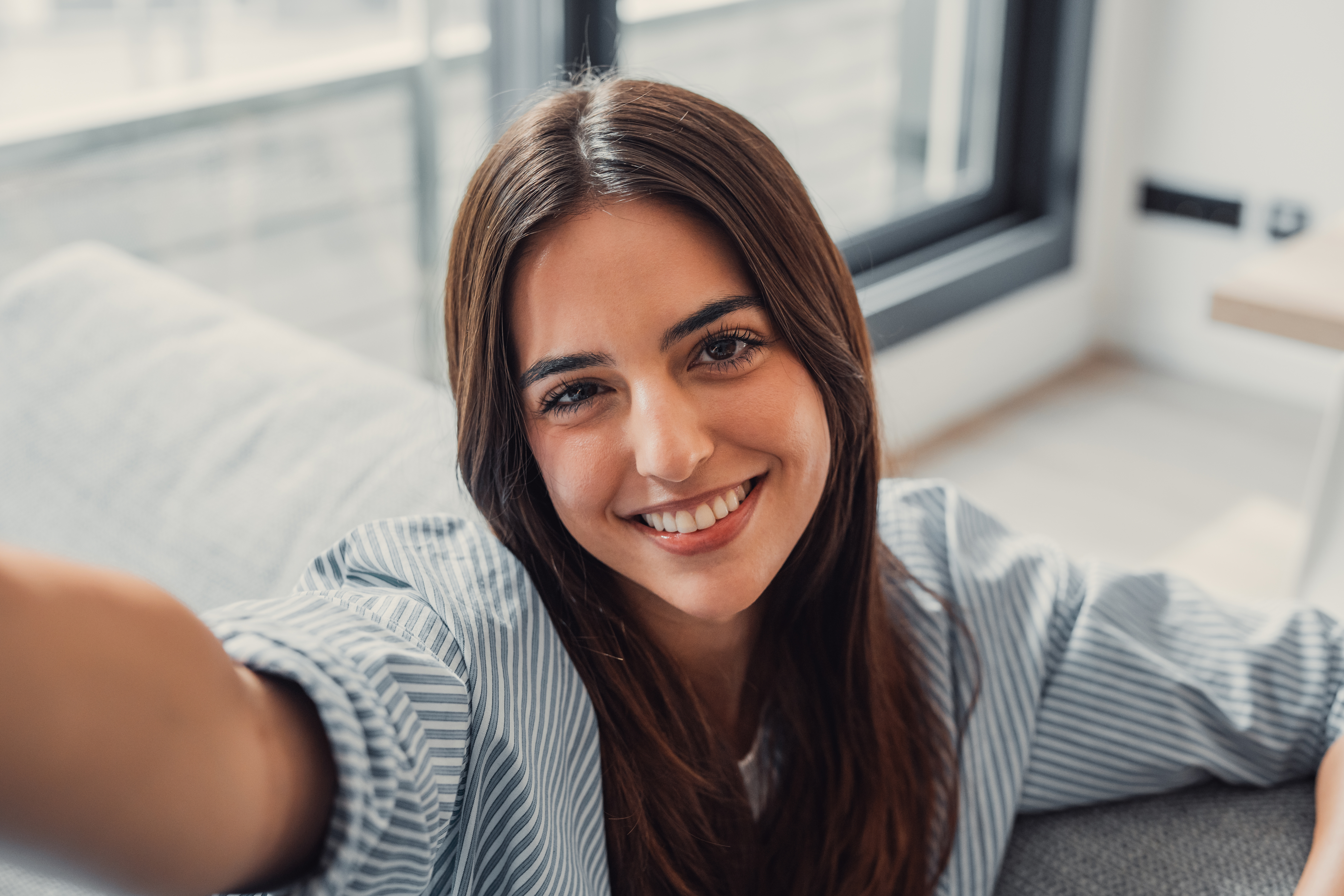 Portrait of Margaret S., a satisfied client with a warm smile